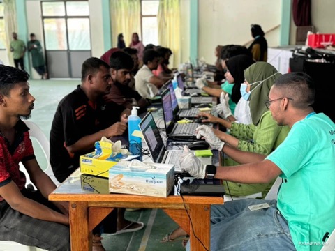 Migrant workers at the registration desk